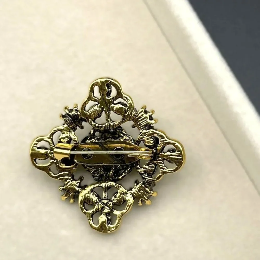 Yellow Gold with Emerald and Peridot Green Crystal Ornate Pin Back Brooch